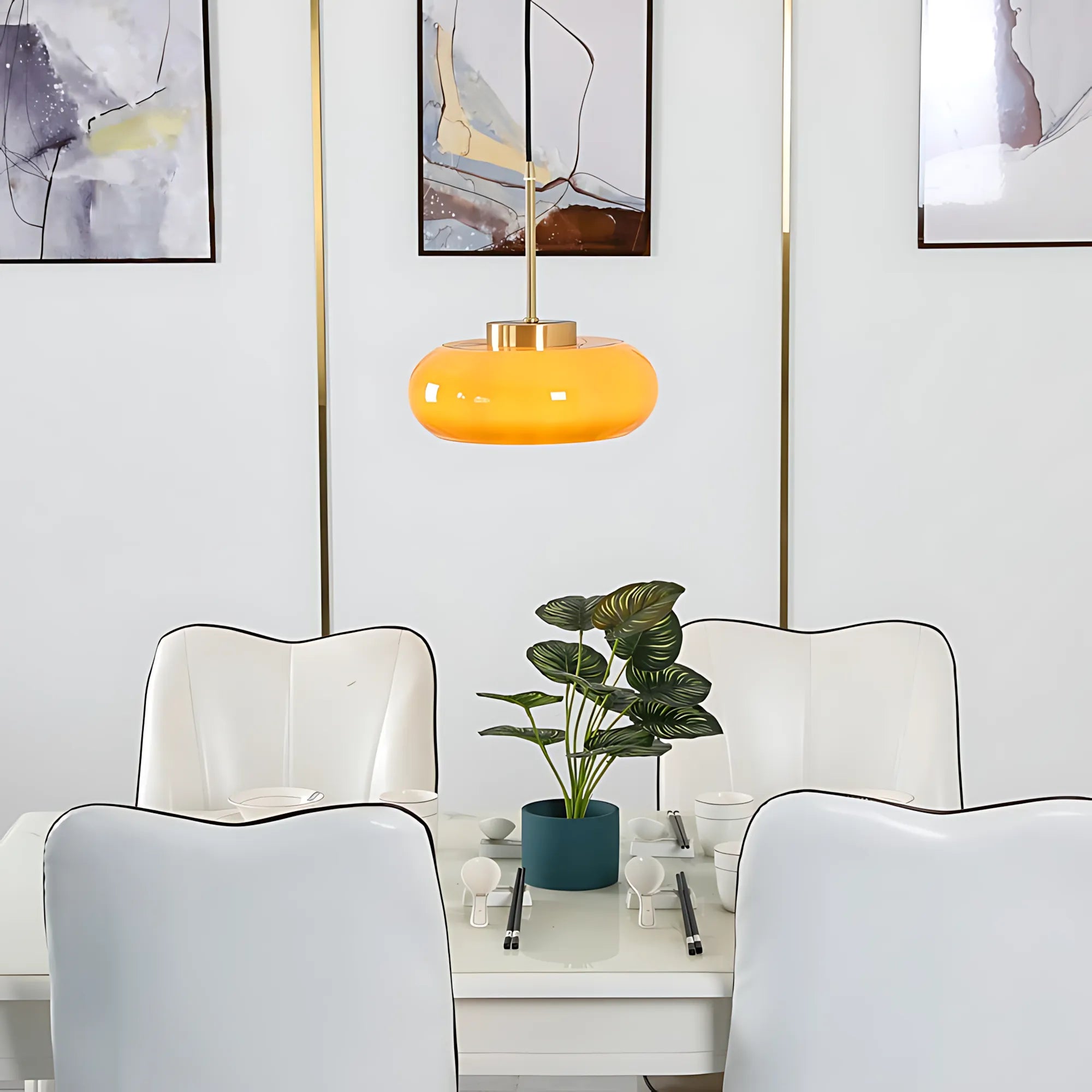 Luna Amber Glass Pendant Light installed above a modern dining table.