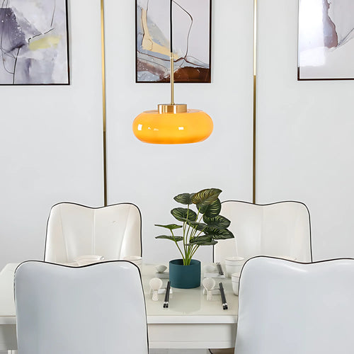 Luna Amber Glass Pendant Light installed above a modern dining table.